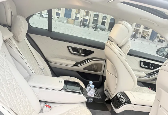 Ivory leather rear cabin of a Mercedes S-Class facing Place Vendôme
