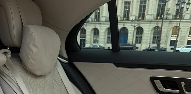 Rear seat of a Mercedes S-Class looking out on Place Vendôme